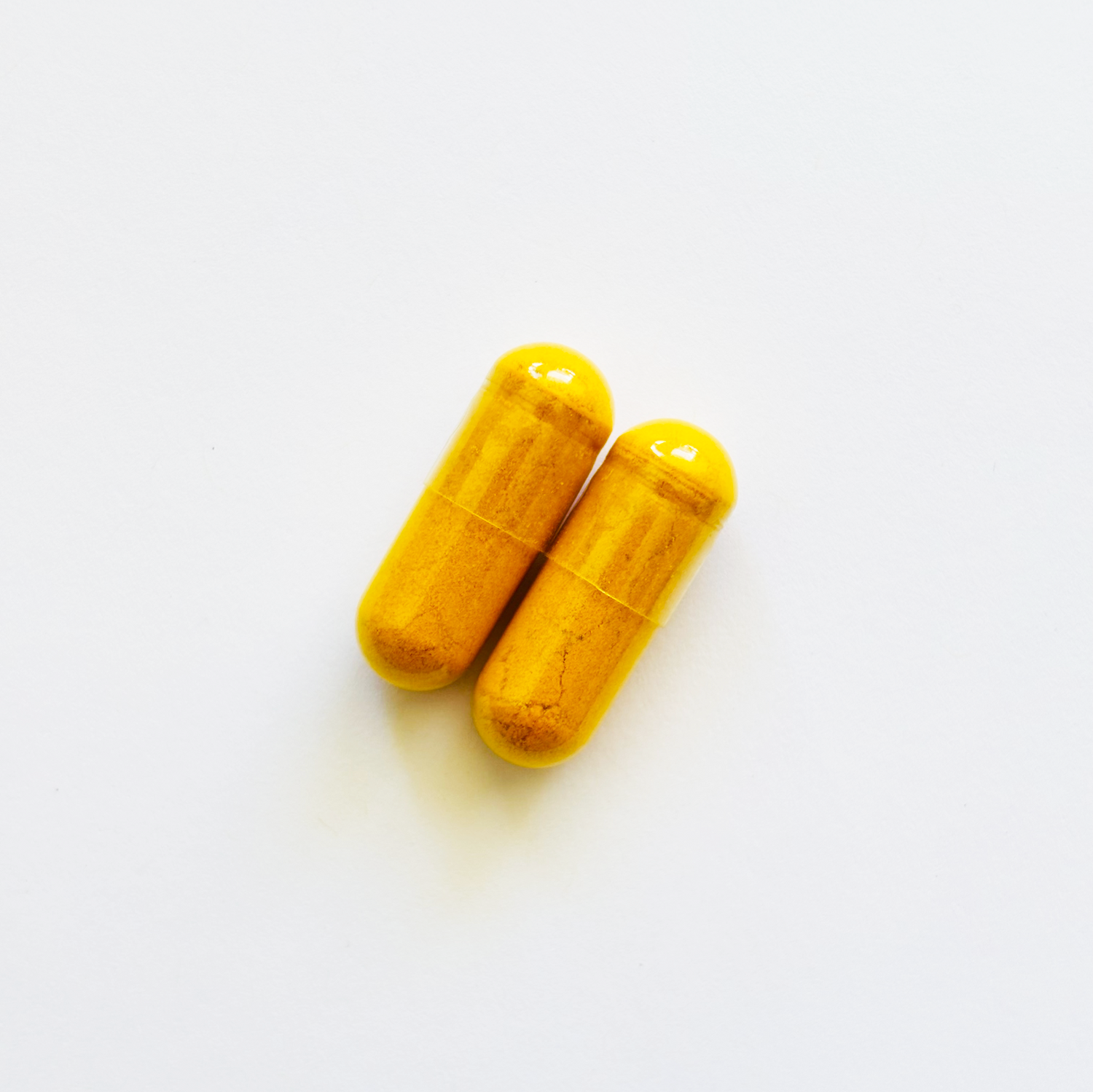 image of two turmeric curcumin vegetable capsules